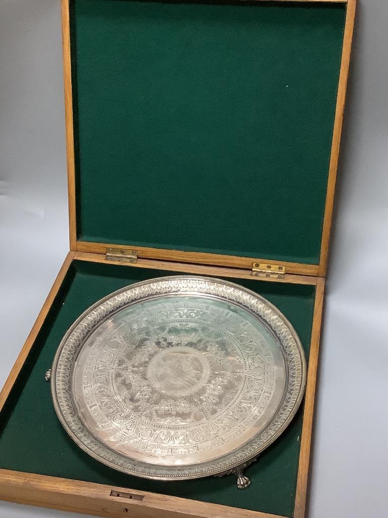 A Victorian engraved silver presentation salver by John Edward Bingham, Sheffield, 1885, width 35.6 cm, 32 oz, in oak box.